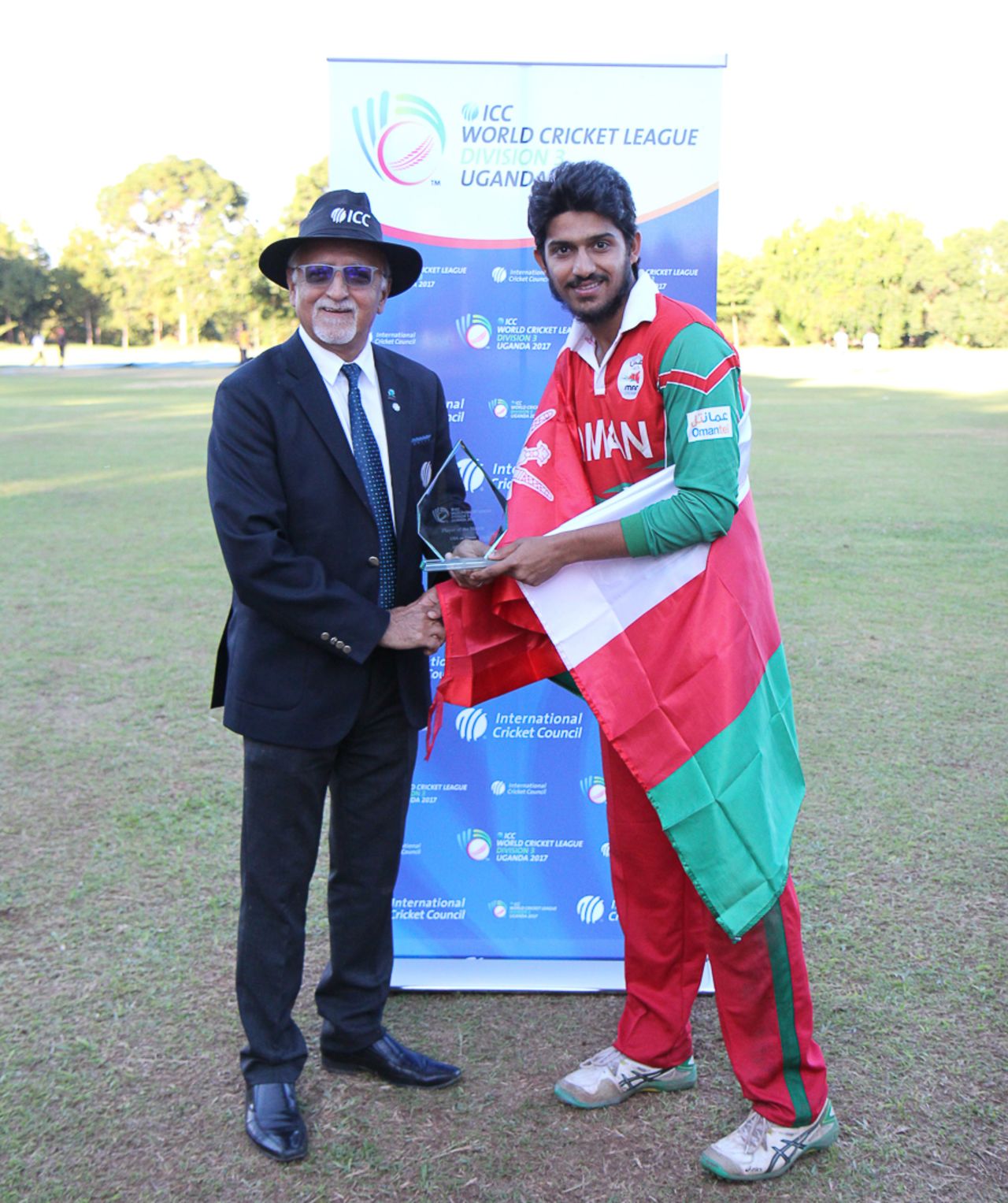 Match referee Dev Govindjee presents Aqib Ilyas his Man of the Match award, Oman v USA, ICC World Cricket League Division Three, Entebbe, May 23, 2017