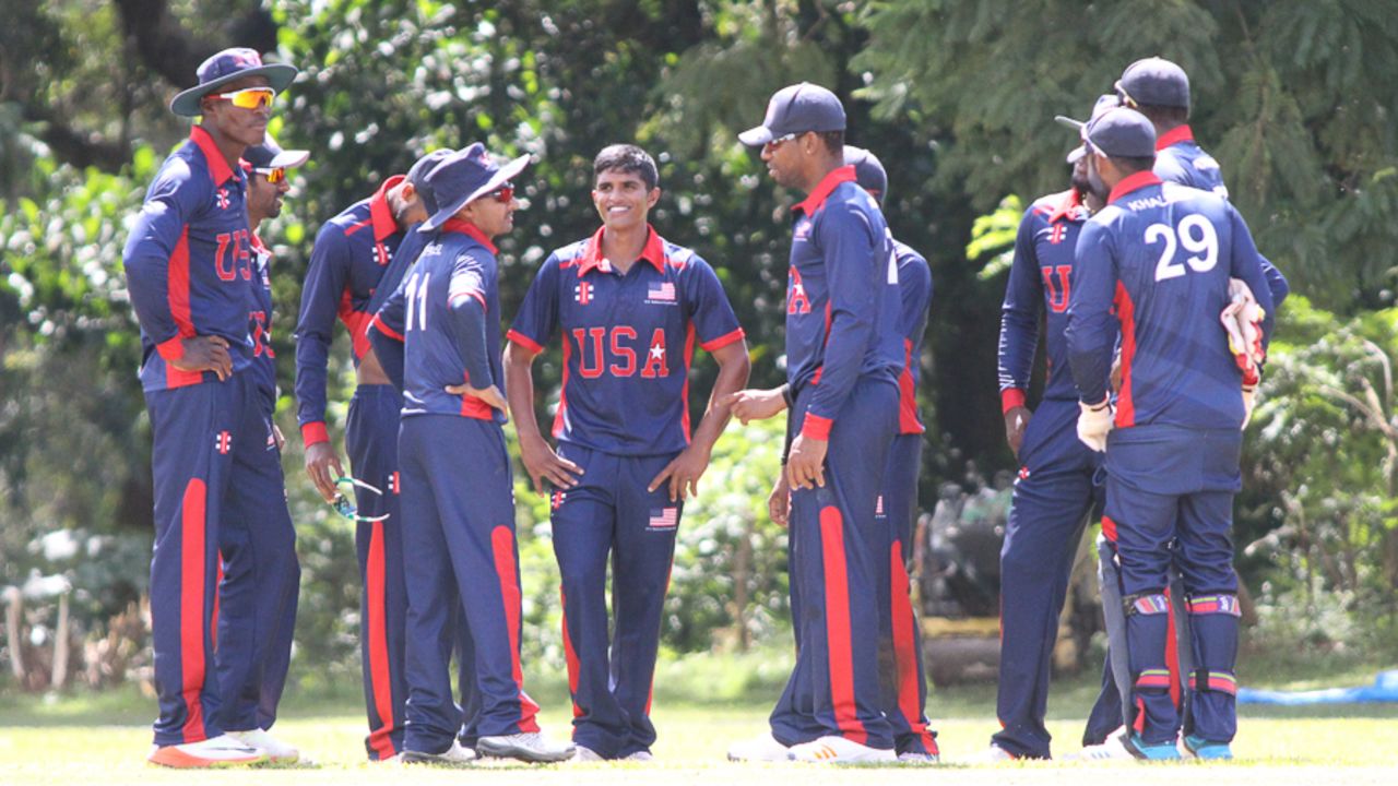 USA huddles after Noshtush Kenjige takes the wicket of Virandeep Singh, Malaysia v USA, ICC World Cricket League Division Three, Kampala, May 24, 2017