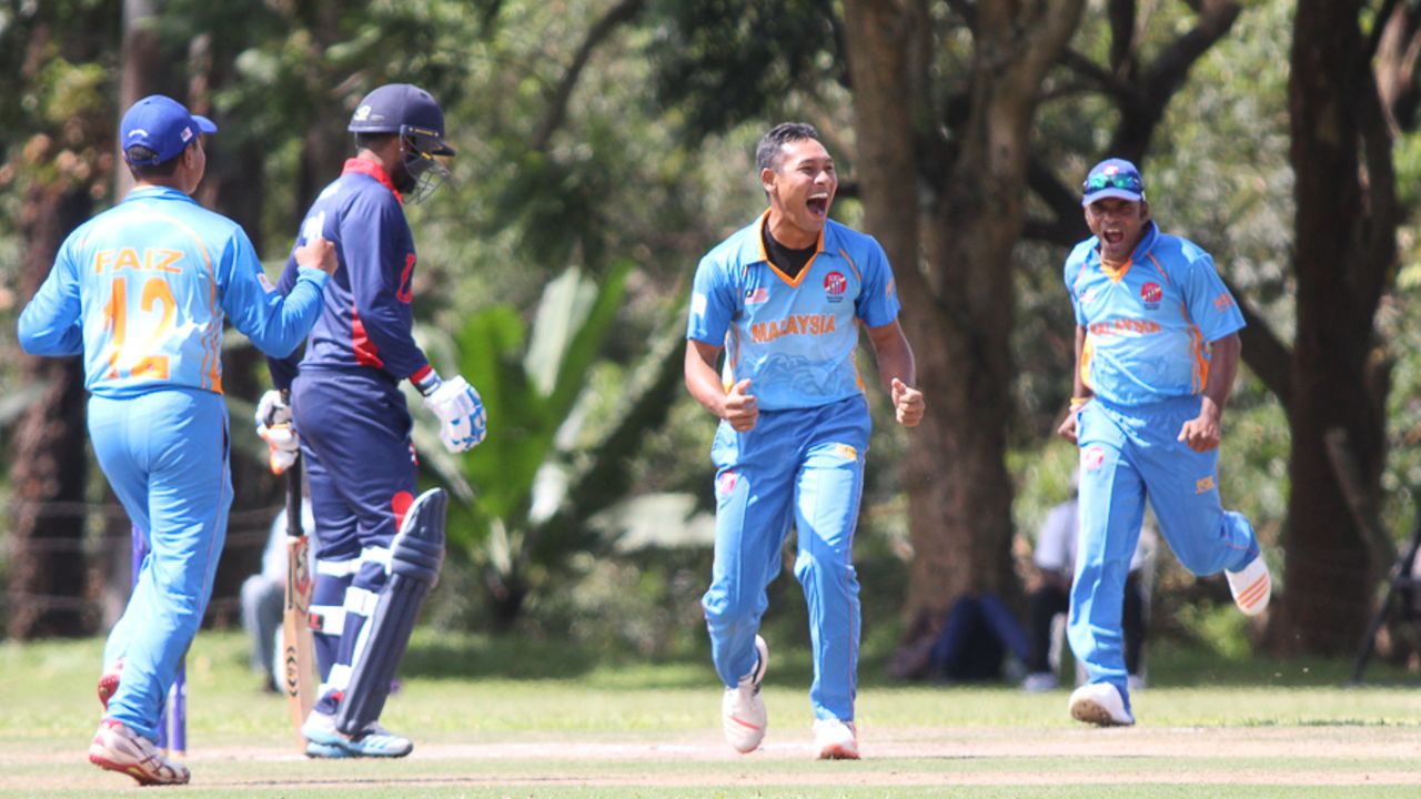Mohammad Shukri celebrates after bowling Elmore Hutchinson, Malaysia v USA, ICC World Cricket League Division Three, Kampala, May 24, 2017