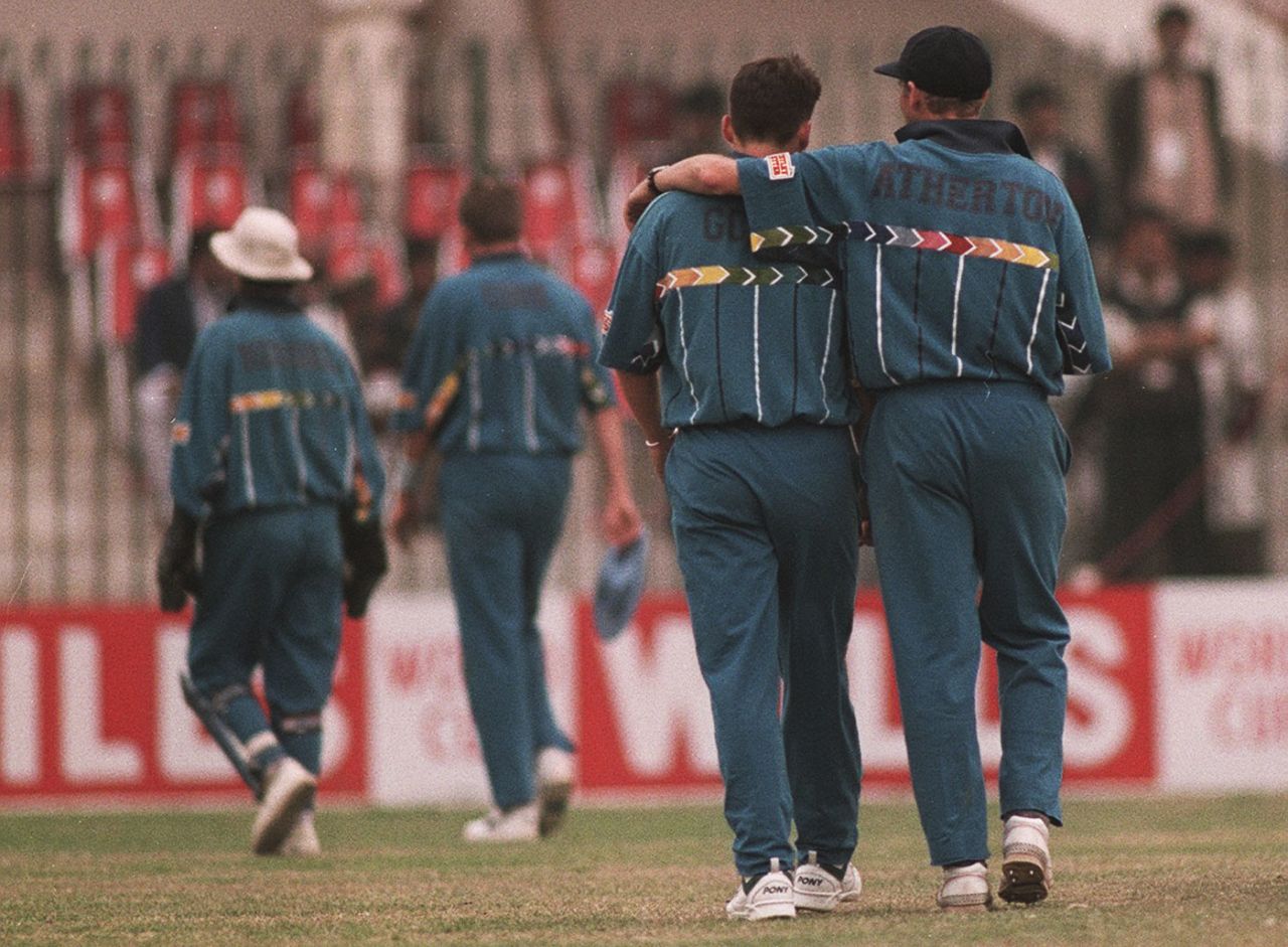 Mike Atherton puts an arm around Darren Gough's shoulder after the bowler went wicketless for 23 runs in three overs, England v Netherlands, Group B, World Cup, Peshawar, February 22, 1996