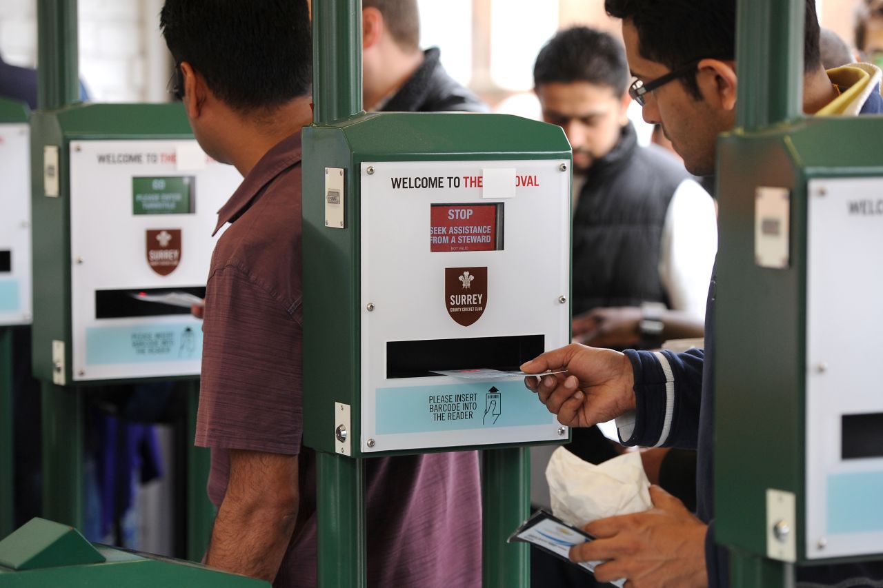 Fans have their tickets scanned as they enter the Kia Oval, June 19, 2013