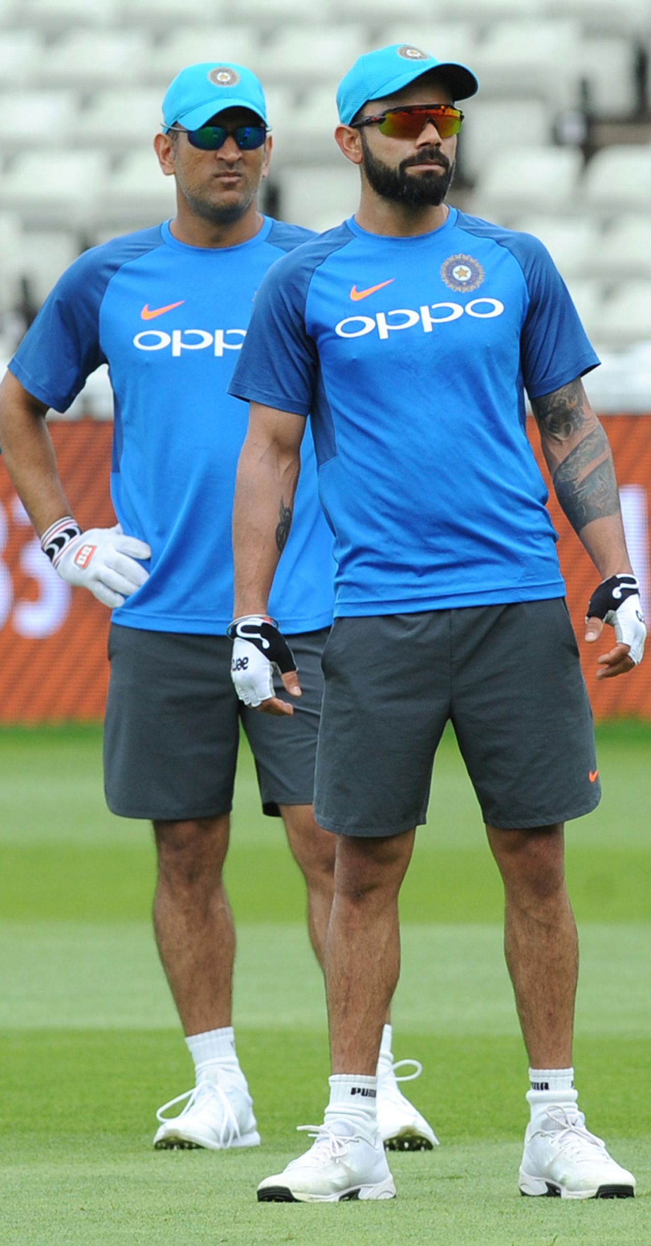 MS Dhoni and Virat Kohli await their turns during a fielding drill, Champions Trophy, Birmingham, June 3, 2017