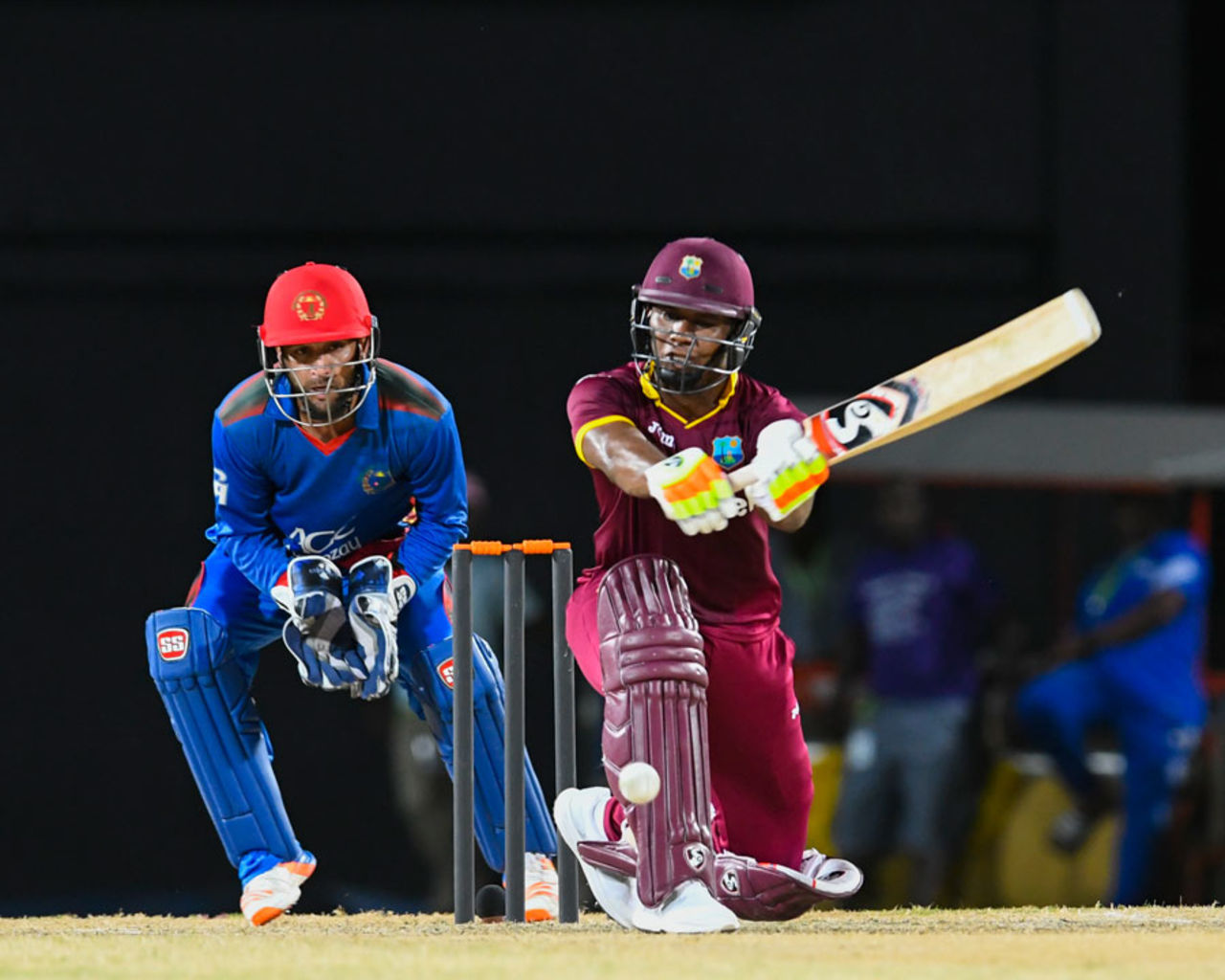 Evin Lewis reaches out to try and connect his sweep shot, West Indies v Afghanistan, 2nd T20I, St Kitts, June 3, 2017
