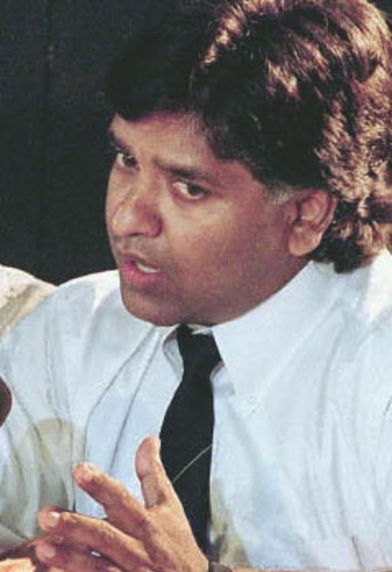 A 15 July 1999 file photo shows former Sri Lankan cricket captain Arjuna Ranatunga at a panel discussion in Colombo. Ranatunga, due to retire shortly from international cricket, has held talks about joining a new right-wing party and contesting parliamentary polls. The Sihala Urumaya, or Sinhalese Heritage party, said it has discussions with Ranatunga, 36, about the possibility of his joining the party and running in elections due before 09 November.