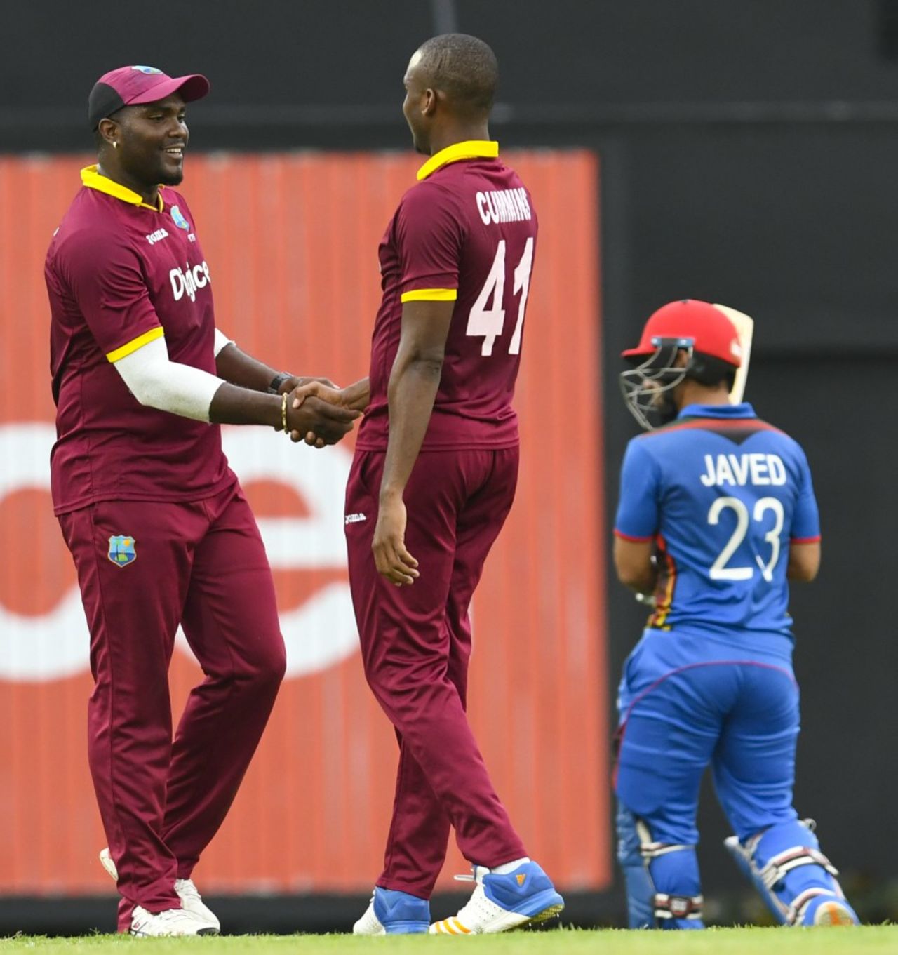 Miguel Cummins and Ashley Nurse celebrate a wicket, West Indies v Afghanistan, 1st ODI, St Lucia, June 9, 2017