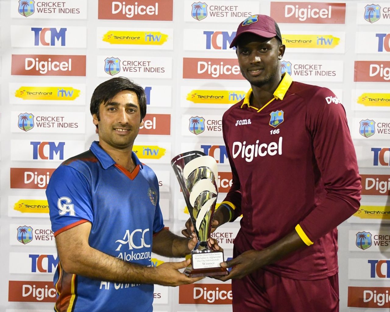 The captains Asghar Stanikzai and Jason Holder share honours after the ODI series between the two teams finished on 1-1, West Indies v Afghanistan, 3rd ODI, St Lucia, June 14, 2017