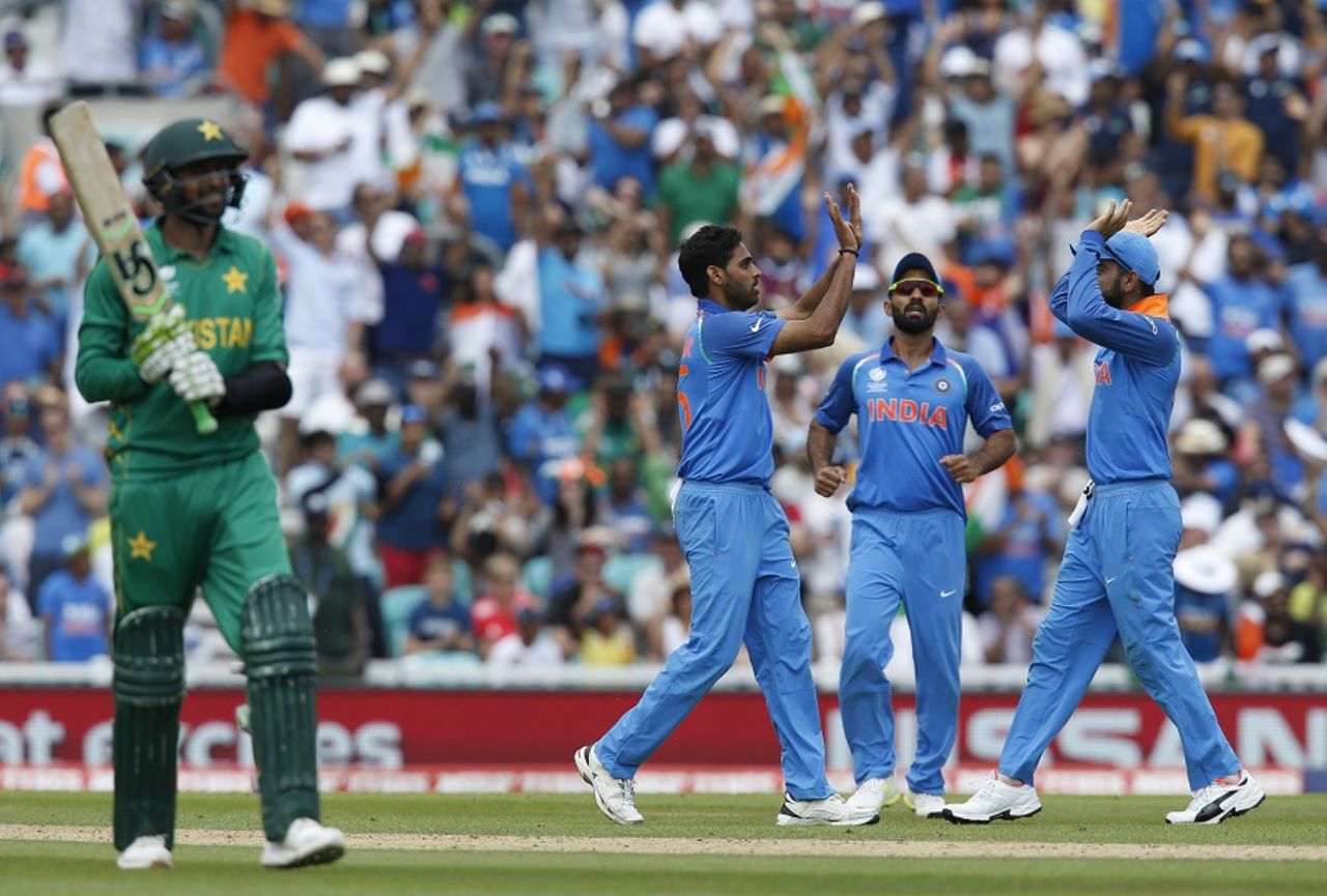 Bhuvneshwar Kumar celebrates with team-mates after dismissing Shoaib Malik, India v Pakistan, Final, Champions Trophy 2017, The Oval, London, June 18, 2017
