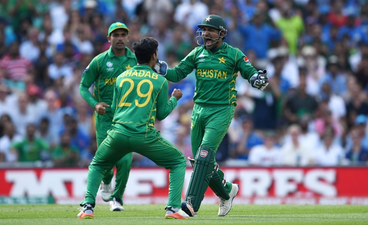 Shadab Khan celebrates with his captain after taking out Kedar Jadhav, India v Pakistan, Final, Champions Trophy 2017, The Oval, London, June 18, 2017