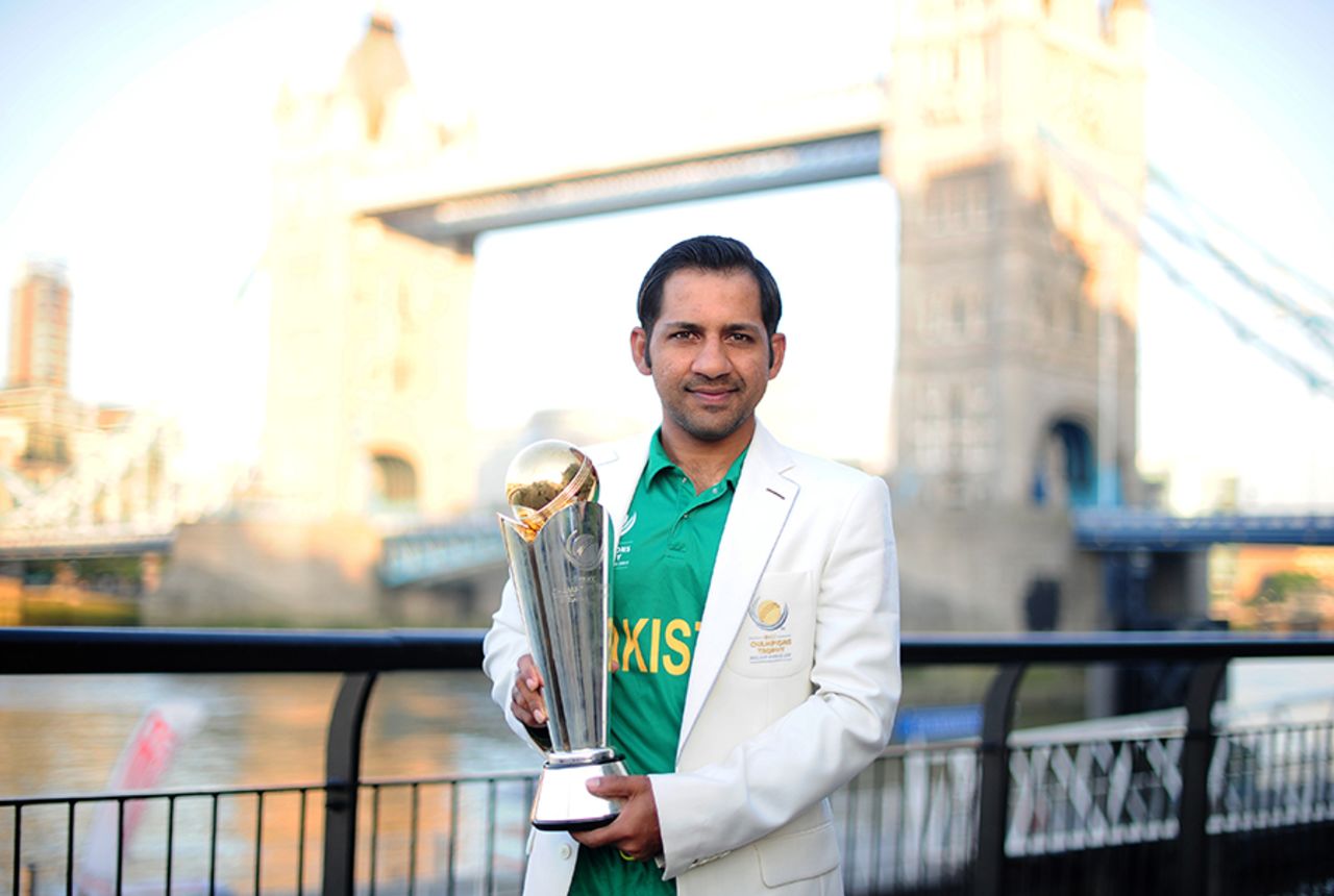 Pakistan captain Sarfraz Ahmed poses with the Champions Trophy near the Tower Bridge, London, June 19, 2017