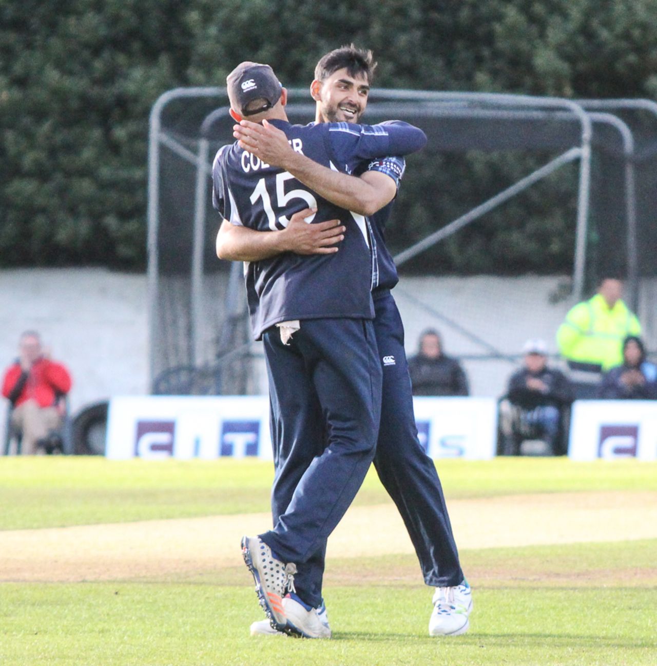Safyaan Sharif gets hugged by captain Kyle Coetzer after taking the final wicket, Scotland v Zimbabwe, 1st ODI, Edinburgh, June 15, 2017