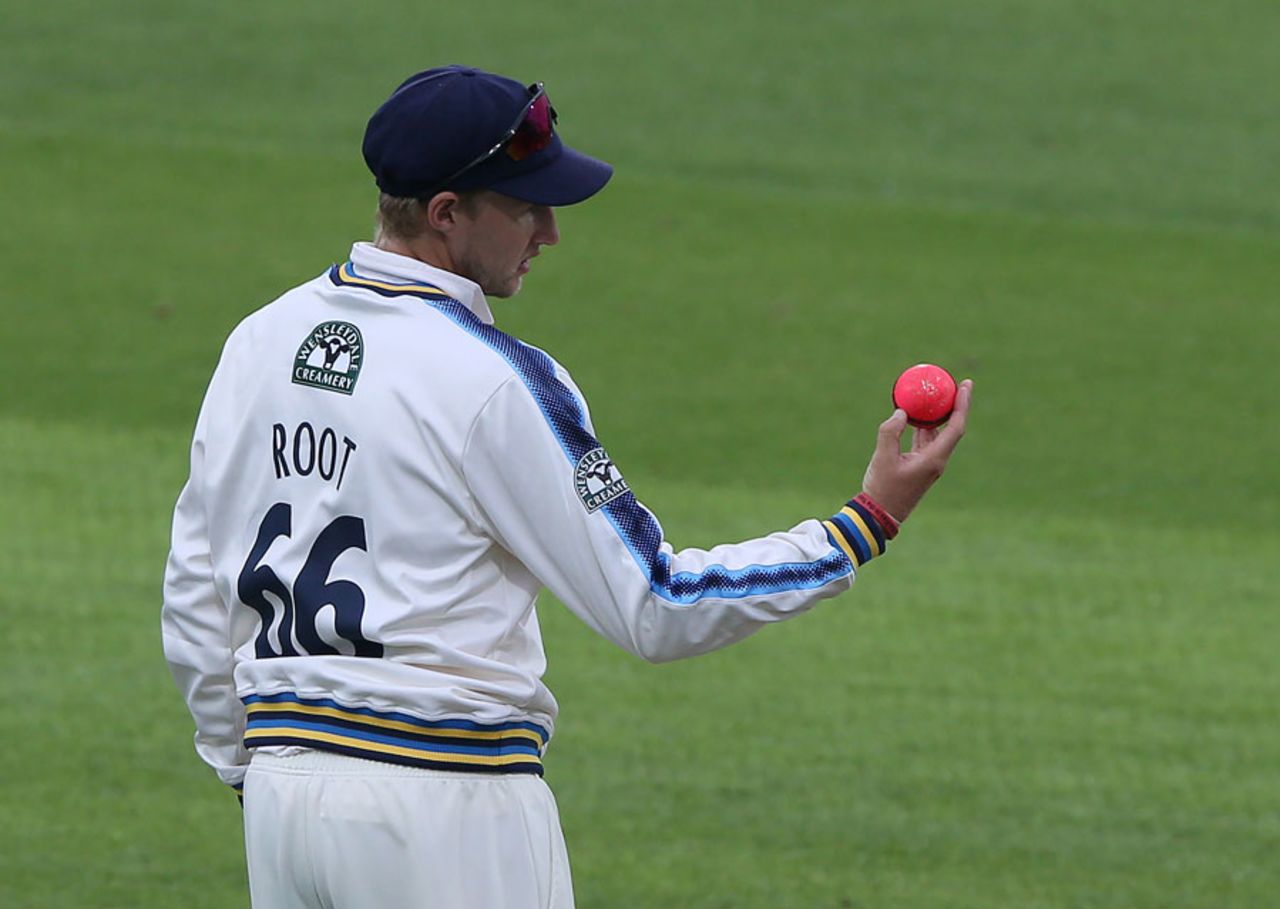 Joe Root inspects the pink ball, Yorkshire v Surrey, Specsavers County Championship Division One, Headingley, 2nd day, June 27, 2017