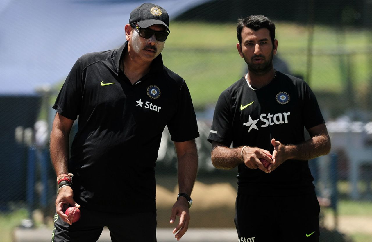 Ravi Shastri and Chesteshwar Pujara talk during a training session, Colombo, August 19, 2015