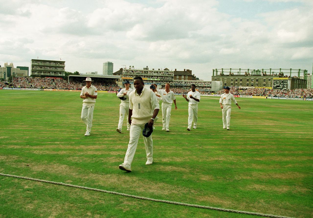 Devon Malcolm leads the team off the field after having taken nine wickets, England v South Africa, 3rd Test, day three, The Oval, August 20, 1994