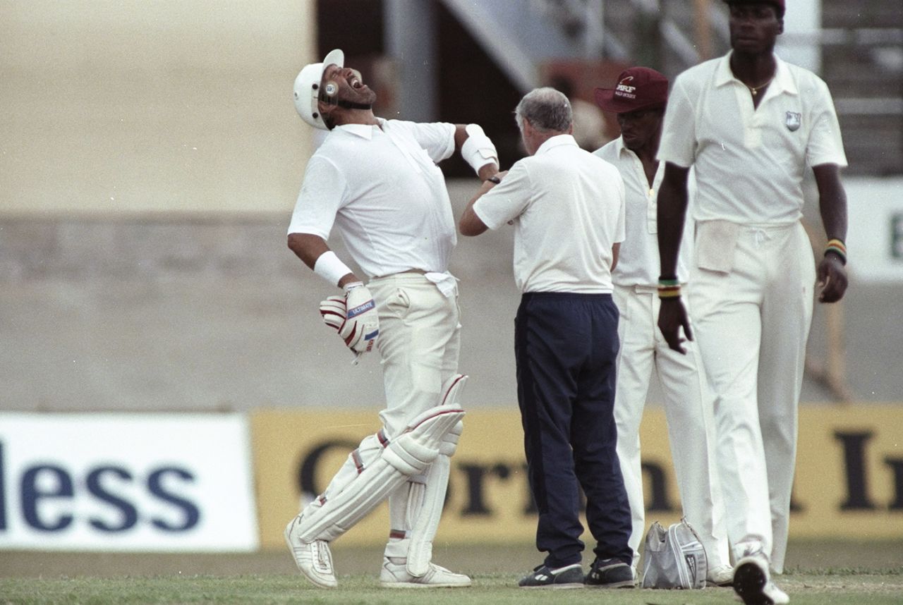 Graham Gooch winces in pain after fast bowler Ezra Moseley bowled a ball that crashed into his fingers and broke a bone, West Indies v England, 3rd Test, Port-of-Spain, 5th day, March 28, 1990