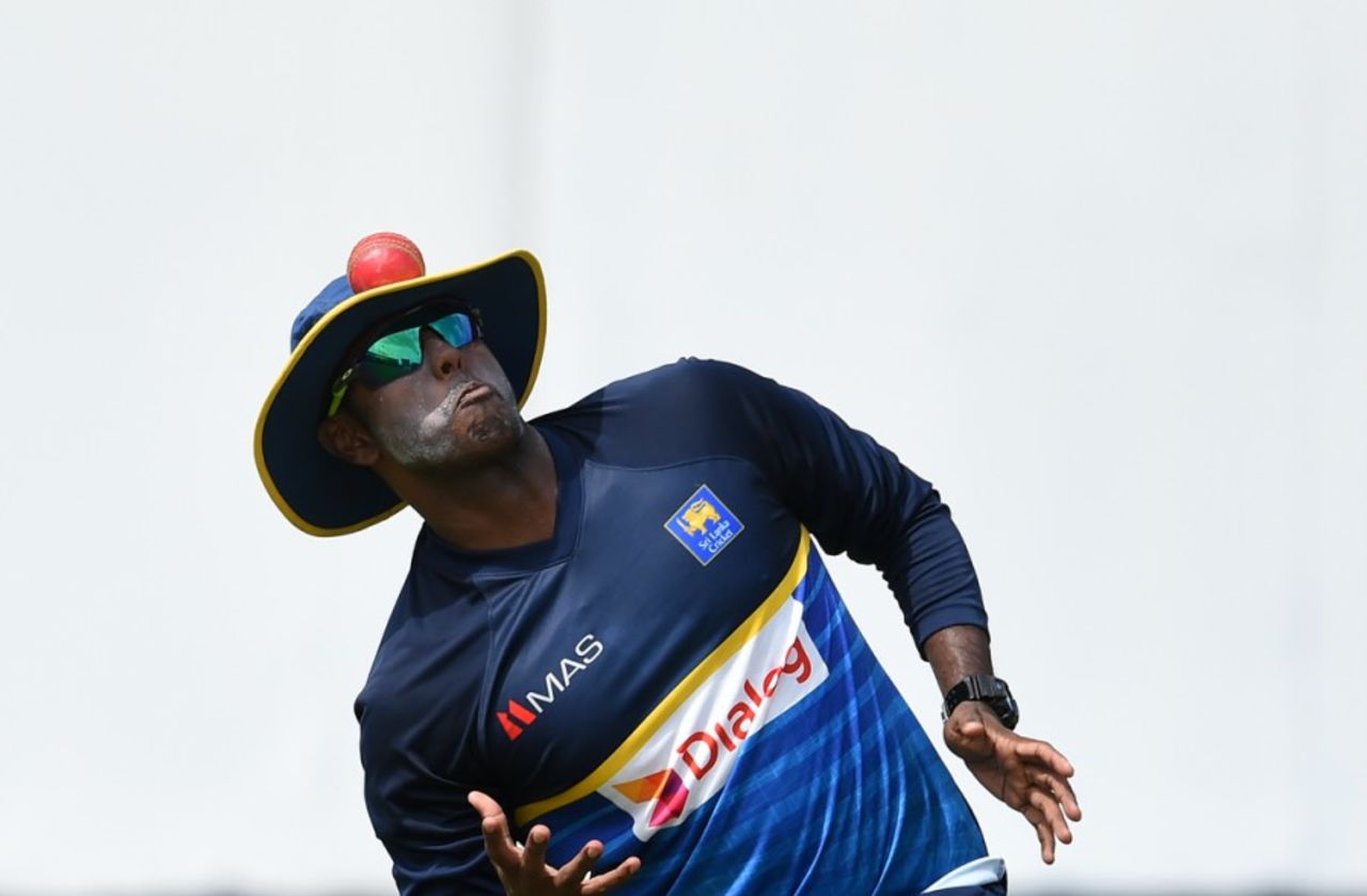 Eyes on the ball: Angelo Mathews balances a ball with his floppy hat, Colombo, July 13, 2017