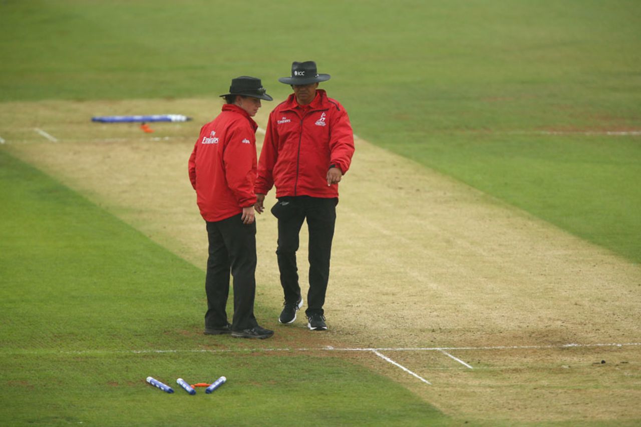 The umpires inspect the pitch during the rain delay, India v New Zealand, Women's World Cup, July 15, 2017