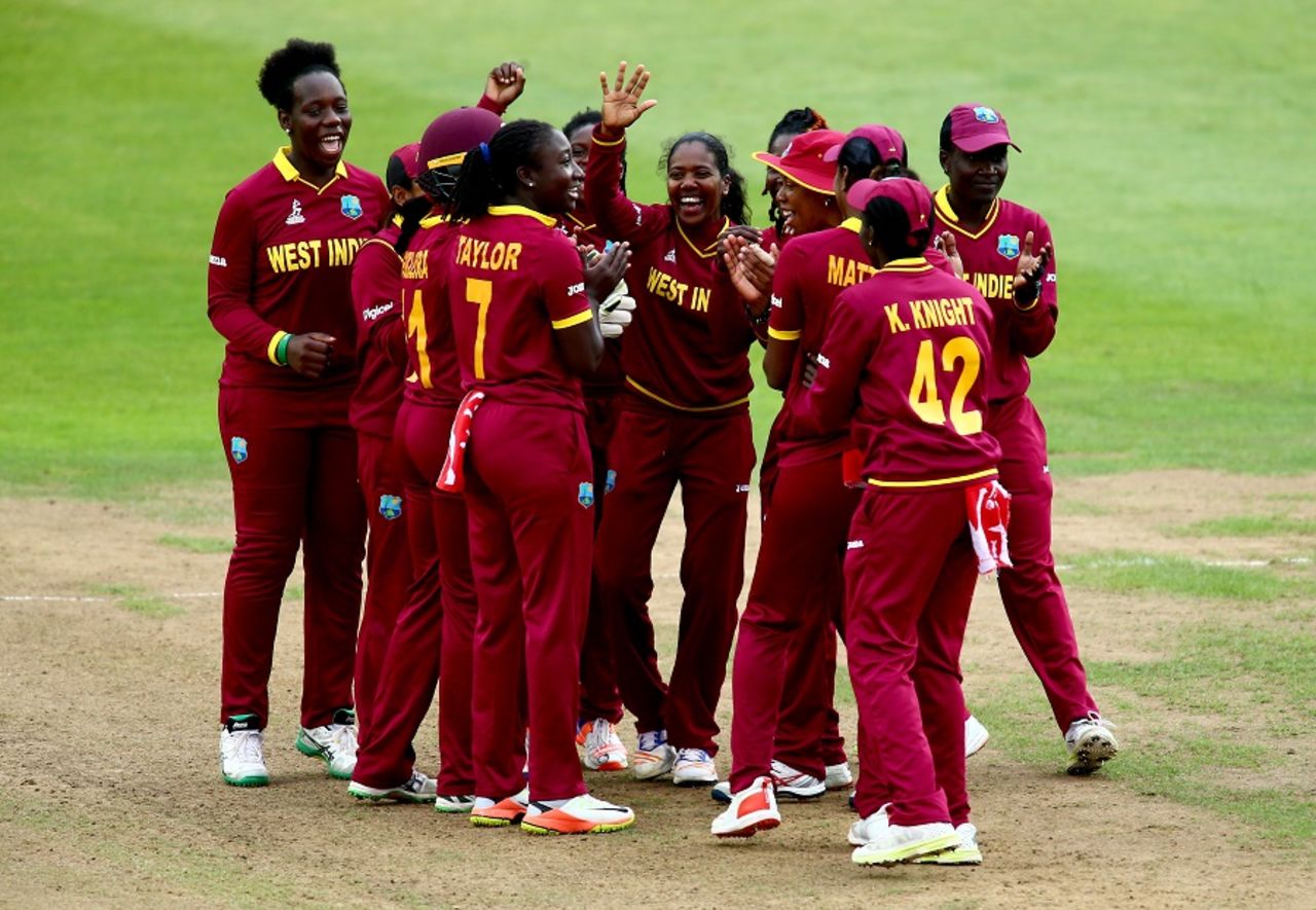 Afy Fletcher is mobbed by her team-mates after taking out Fran Wilson, England v West Indies, Women's World Cup, Bristol, July 15, 2017