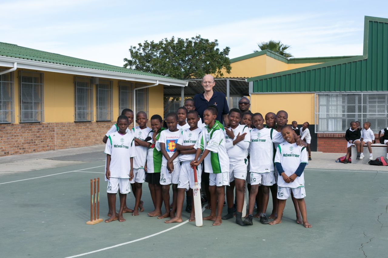 Vince van der Bijl poses with kids at Ukhanyo Primary School, Masiphumelele, South Africa