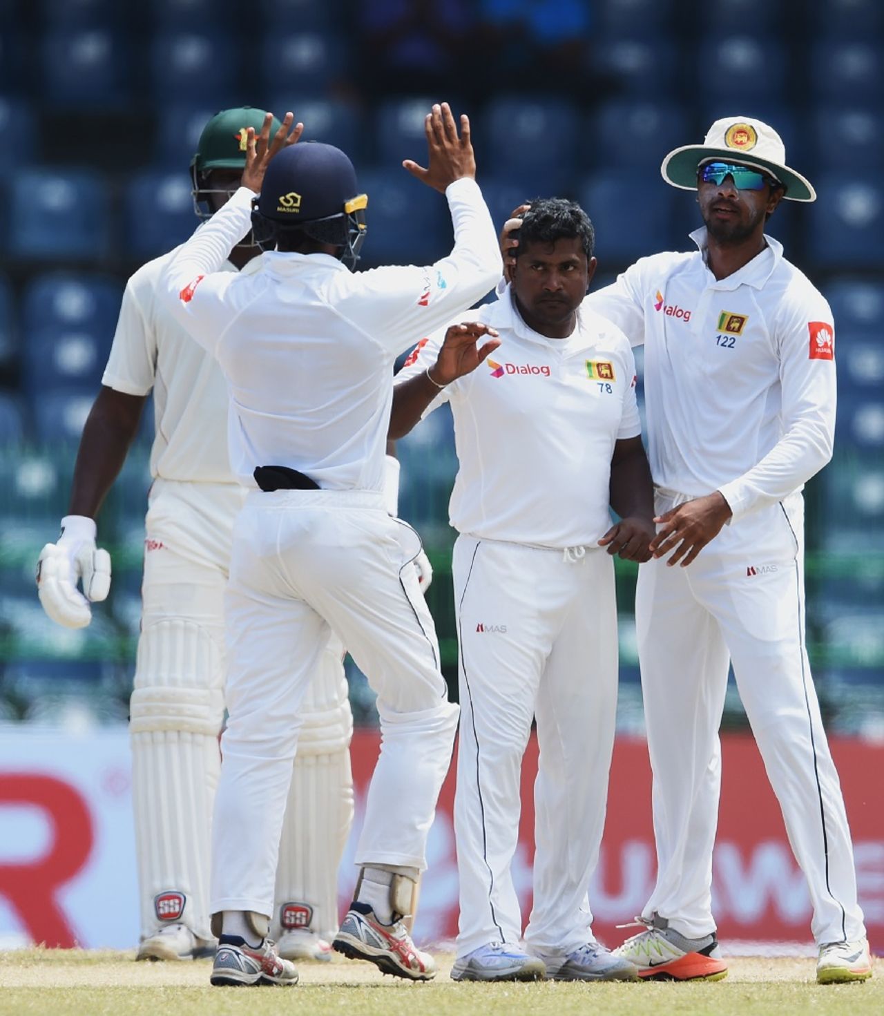 Rangana Herath is mobbed by his team-mates, Sri Lanka v Zimbabwe, only Test, 3rd day, Colombo, July 16, 2017