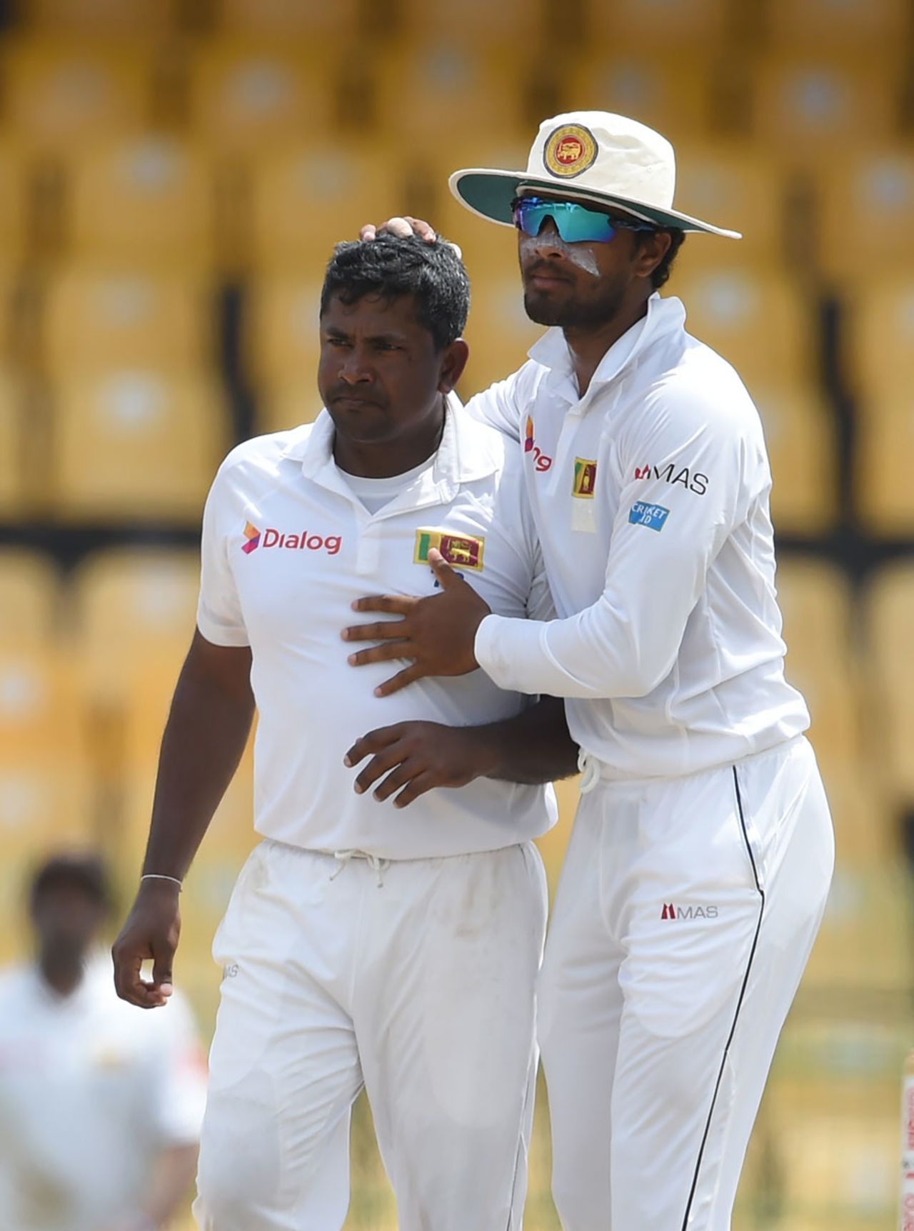 Dinesh Chandimal embraces a tired Ranagana Herath after the spinner picked up his 31st five-wicket haul, Sri Lanka v Zimbabwe, only Test, 4th day, Colombo, July 17, 2017
