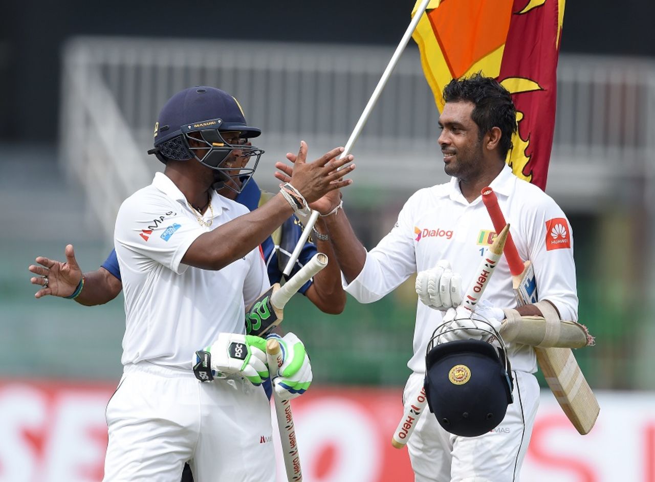 Dilruwan Perera and Asela Gunaratne celebrate after steering Sri Lanka to victory, Sri Lanka v Zimbabwe, only Test, 5th day, Colombo, July 18, 2017