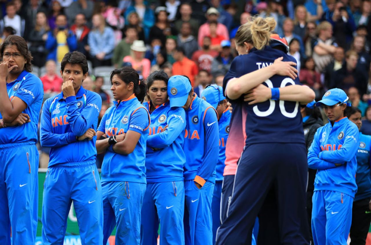 A tale of contrasts: The Indian team looks on as England celebrate the win, England v India, Women's World Cup final, Lord's, July 23, 2017