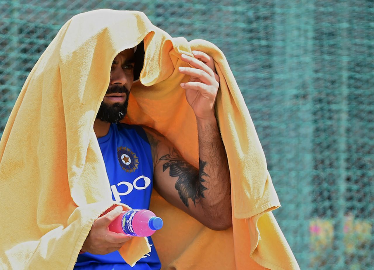 Virat Kohli tries to escape from the heat, Galle, July 25, 2017