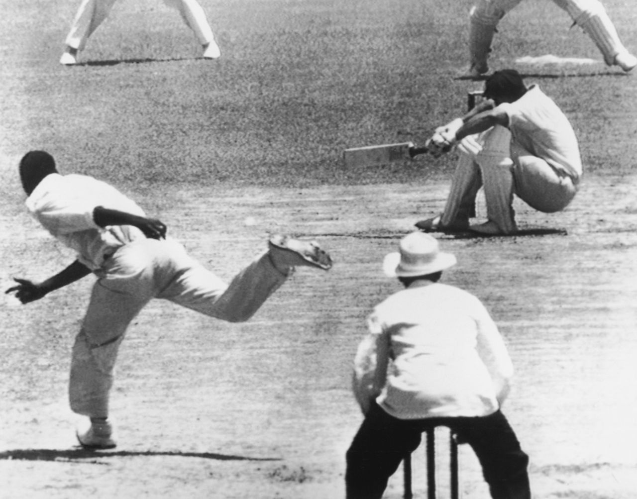 Norman O'Neill ducks to evade a Wes Hall bouncer, Australia v West Indies, 1st Test, Brisbane, 4th day, December 13, 1960