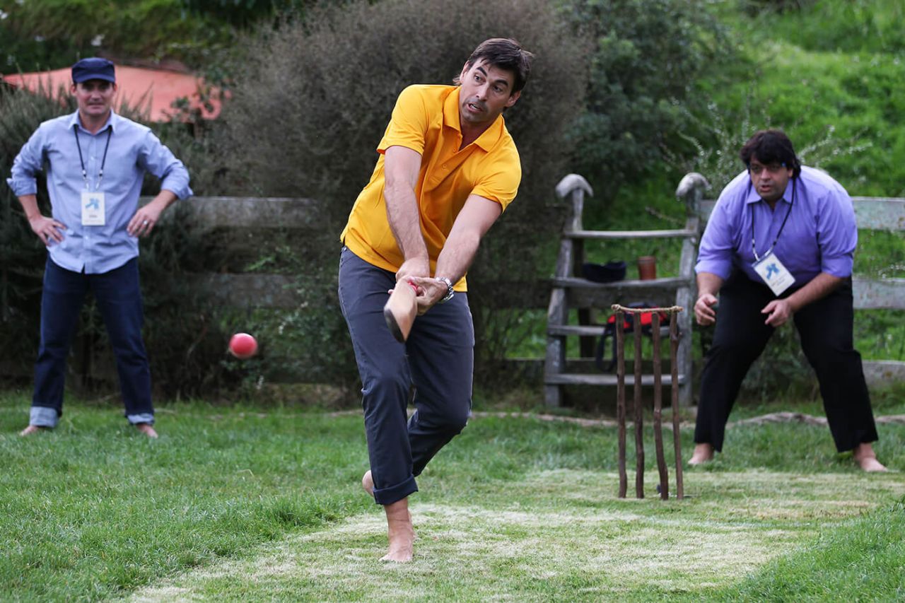 Stephen Fleming bats during a backyard cricket match at the Hobbiton movie set in Matamata, New Zealand, March 9, 2015