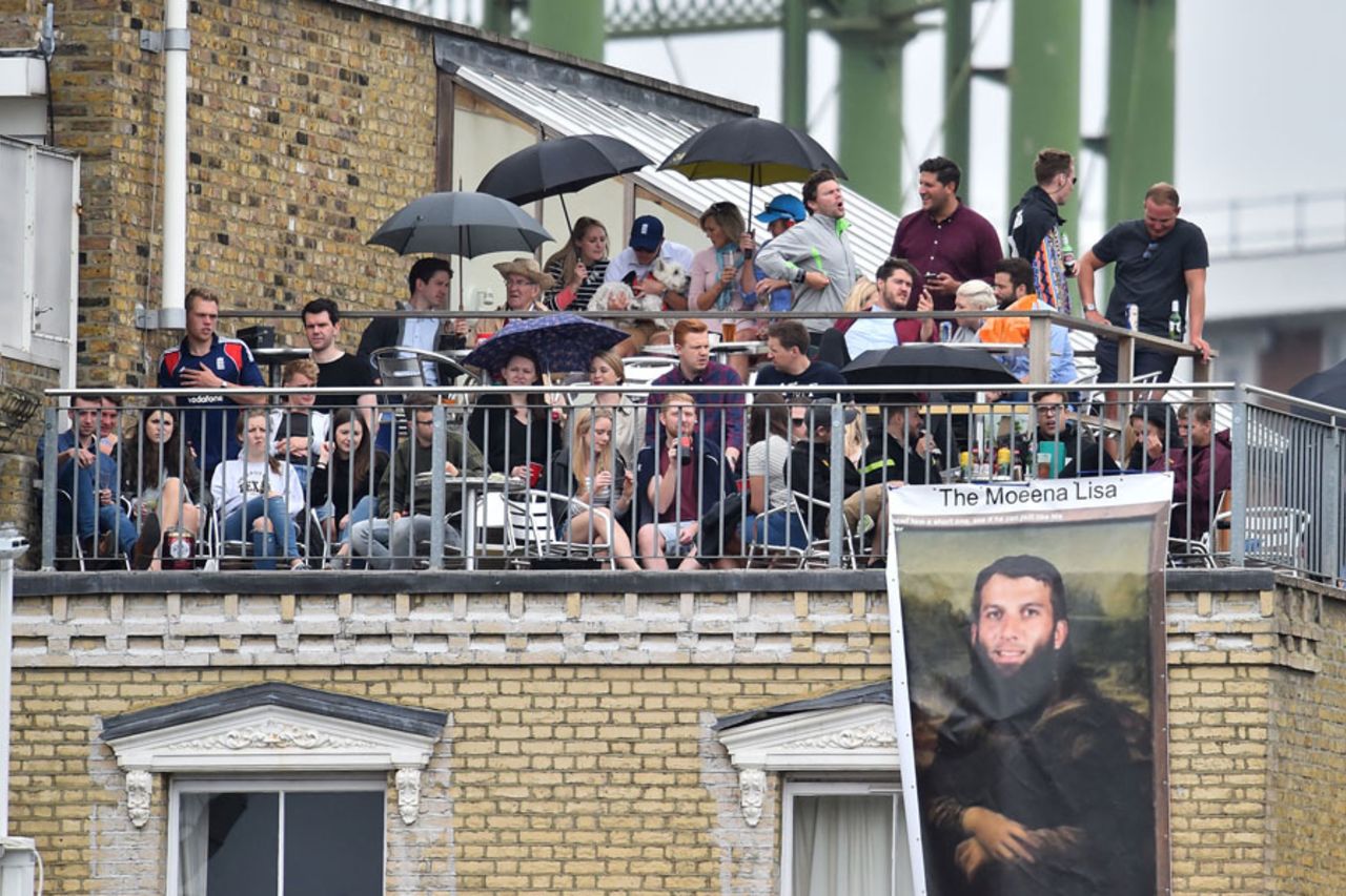 Roof with a view: fans watch on from a neighbouring flat before the rain, England v South Africa, 3rd Investec Test, The Oval, 3rd day, July 29, 2017