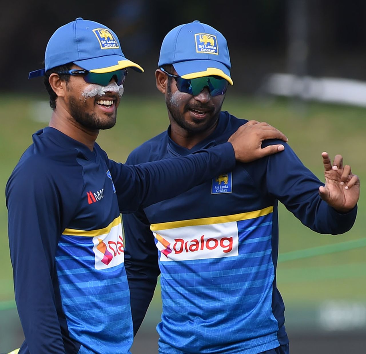 Dinesh Chandimal and Upul Tharanga share a light moment during a nets session