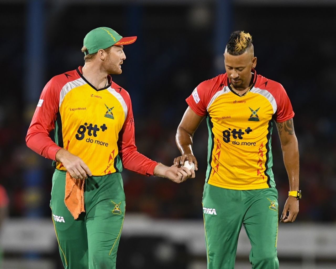 Martin Guptill and Rayad Emrit share a moment in the middle, Trinbago Knight Riders v Guyana Amazon Warriors, CPL 2017, Port of Spain, August 11, 2017