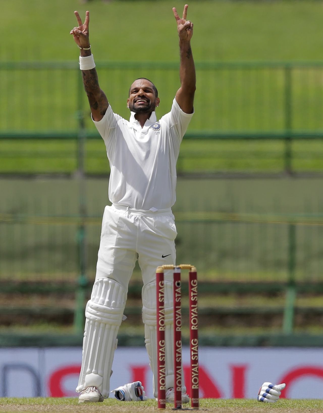 Shikhar Dhawan celebrated his sixth Test hundred with a peace out (or victory?) gesture at the Indian team dressing room, Sri Lanka v India, 3rd Test, 1st day, Pallekele, August 12, 2017