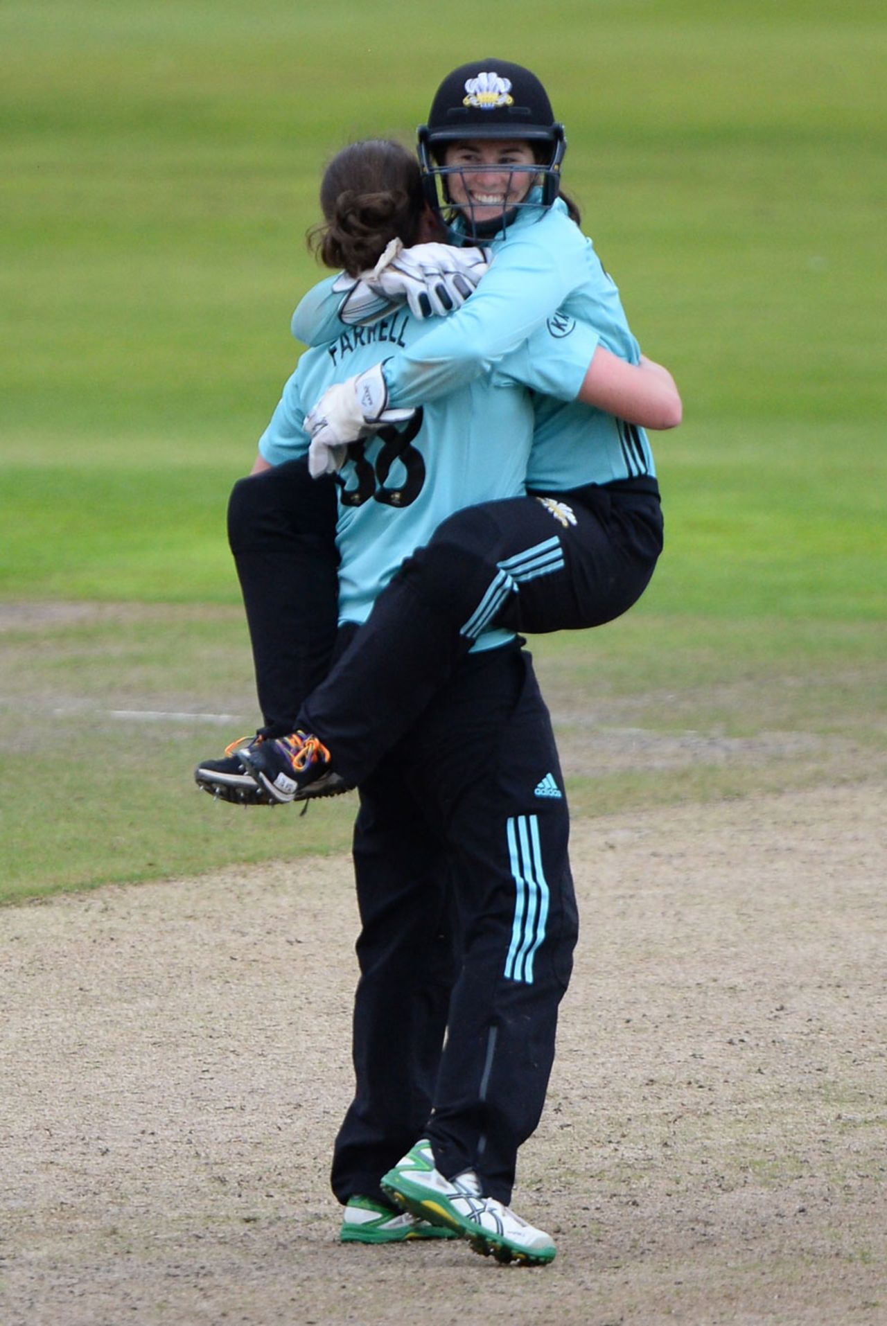 Rene Farrell gets a hug from Tammy Beaumont after sealing victory, Lancashire Thunder v Surrey Stars, Kia Super League, Old Trafford, August 16, 2017