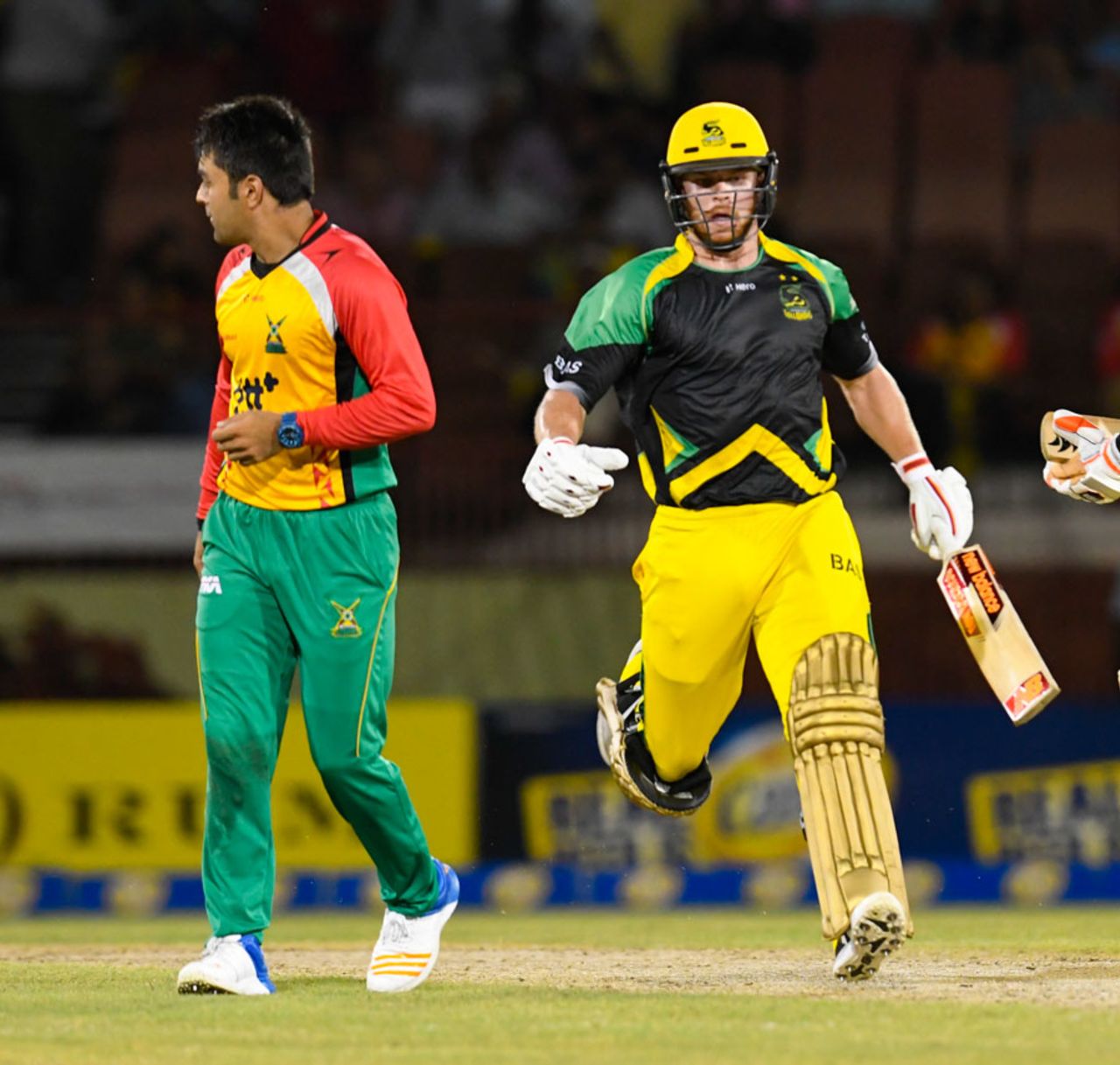 Glenn Phillips runs past Rashid Khan, Jamaica Tallawahs v Amazon Guyana Warriors, CPL 2017, Providence, August 17, 2017