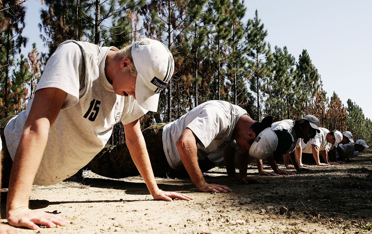 Dan Cullen (left) leads the Australian players in push-ups at their boot camp, August 23, 2006
