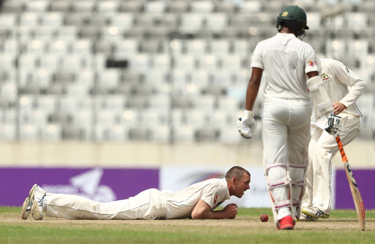 Josh Hazlewood tries to get his bearings after attempting a catch off his own bowling, Bangladesh v Australia, 1st Test, Mirpur, 1st day, August 27, 2017