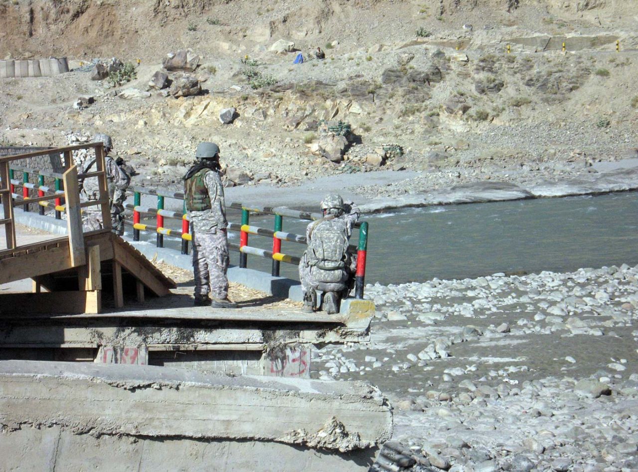 US soldiers stand guard on Marawara bridge, Kunar province, Afghanistan, 2010