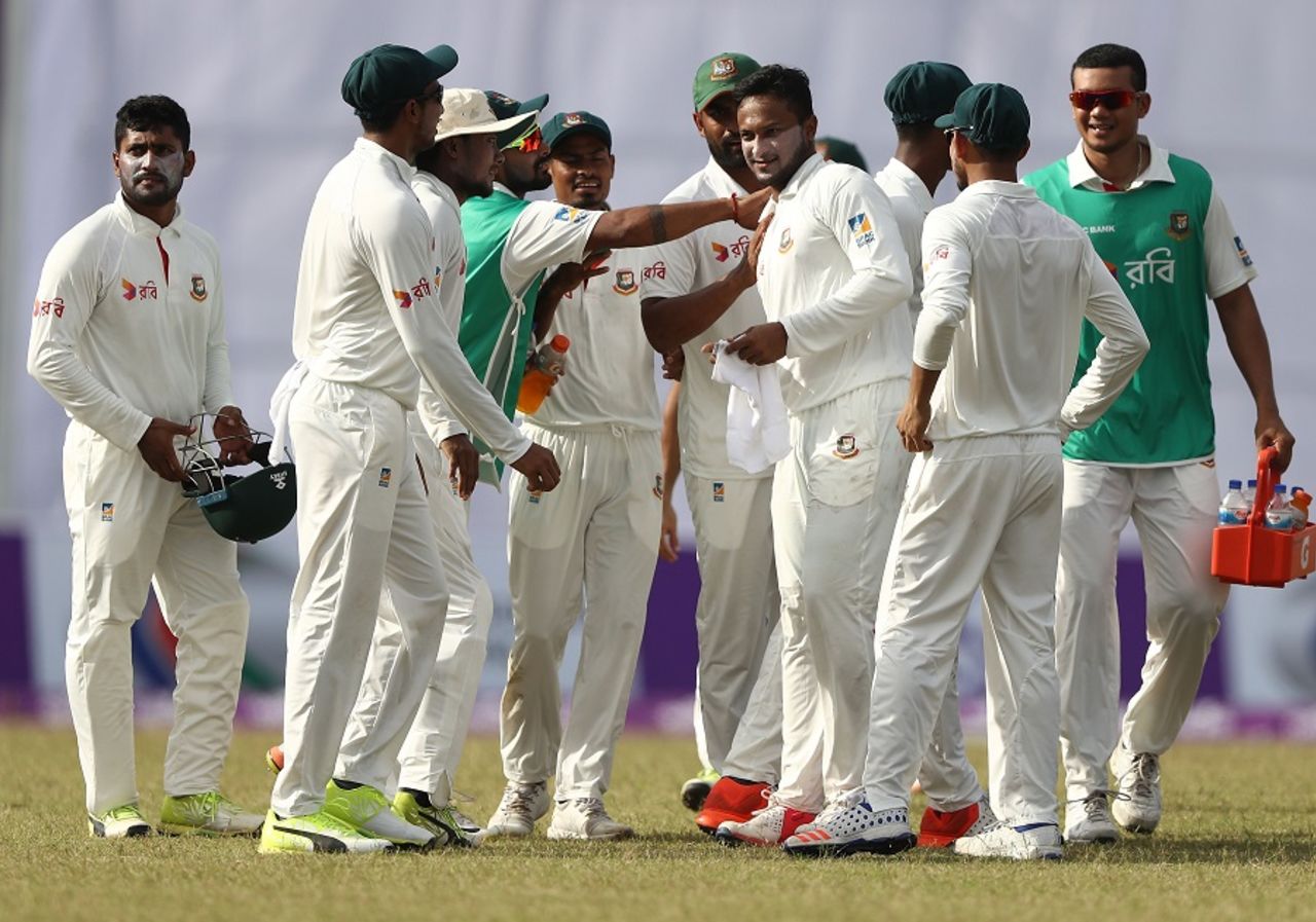 Shakib Al Hasan is mobbed by his team-mates, Bangladesh v Australia, 1st Test, Mirpur, 3rd day, August 29, 2017