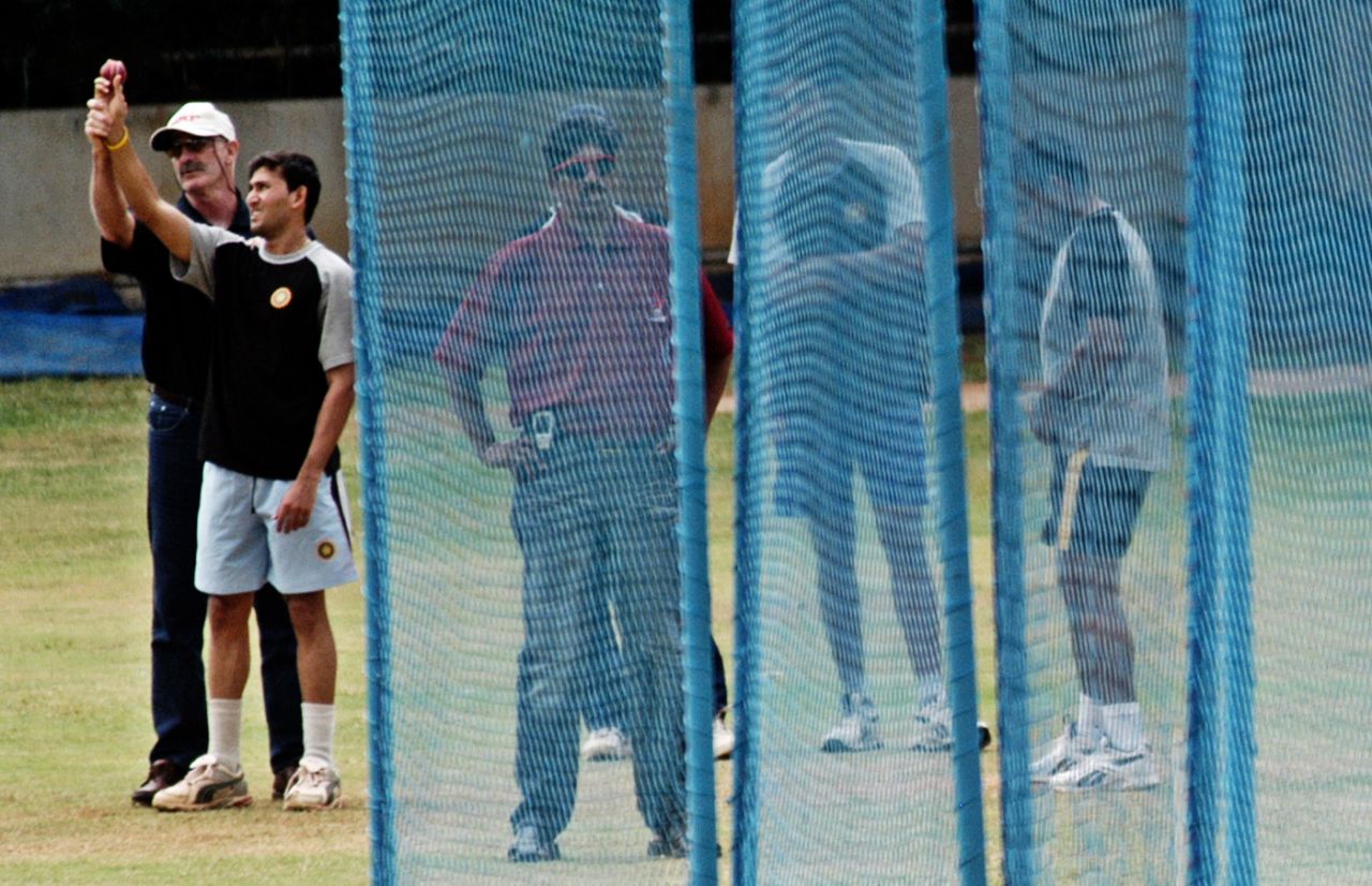 Dennis Lillee has a look at Ajit Agarkar's bowling action at a fitness and conditioning camp for fast bowlers in Bangalore, July 2, 2005