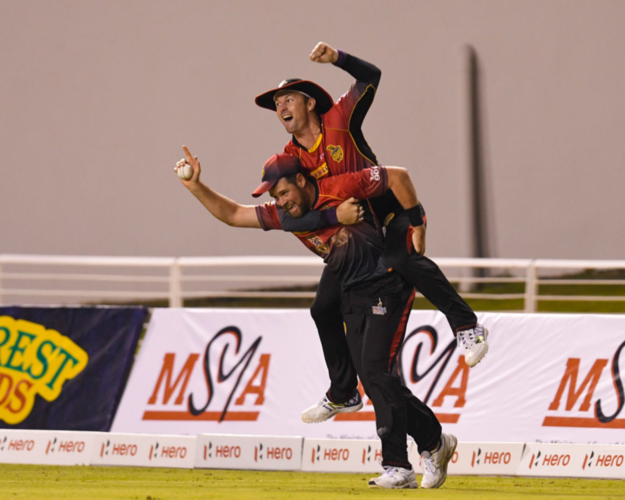 Dan Christian celebrates with Colin Munro after taking a catch, St Kitts and Nevis Patriots v Trinbago Knight Riders, CPL 1st Qualifier, Trinidad, 5 September, 2017