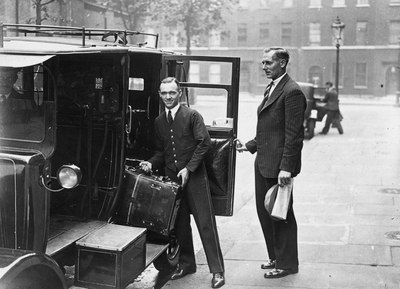 Hedley Verity (right) has his bags loaded into a taxi as he leaves London after the Test, England v Australia, second Test, Lord's, June 26, 1934