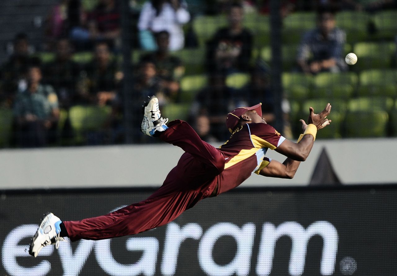 Dwayne Bravo dives to take a catch, Australia v West Indies, World T20, Group 2, Mirpur, March 28, 2014
