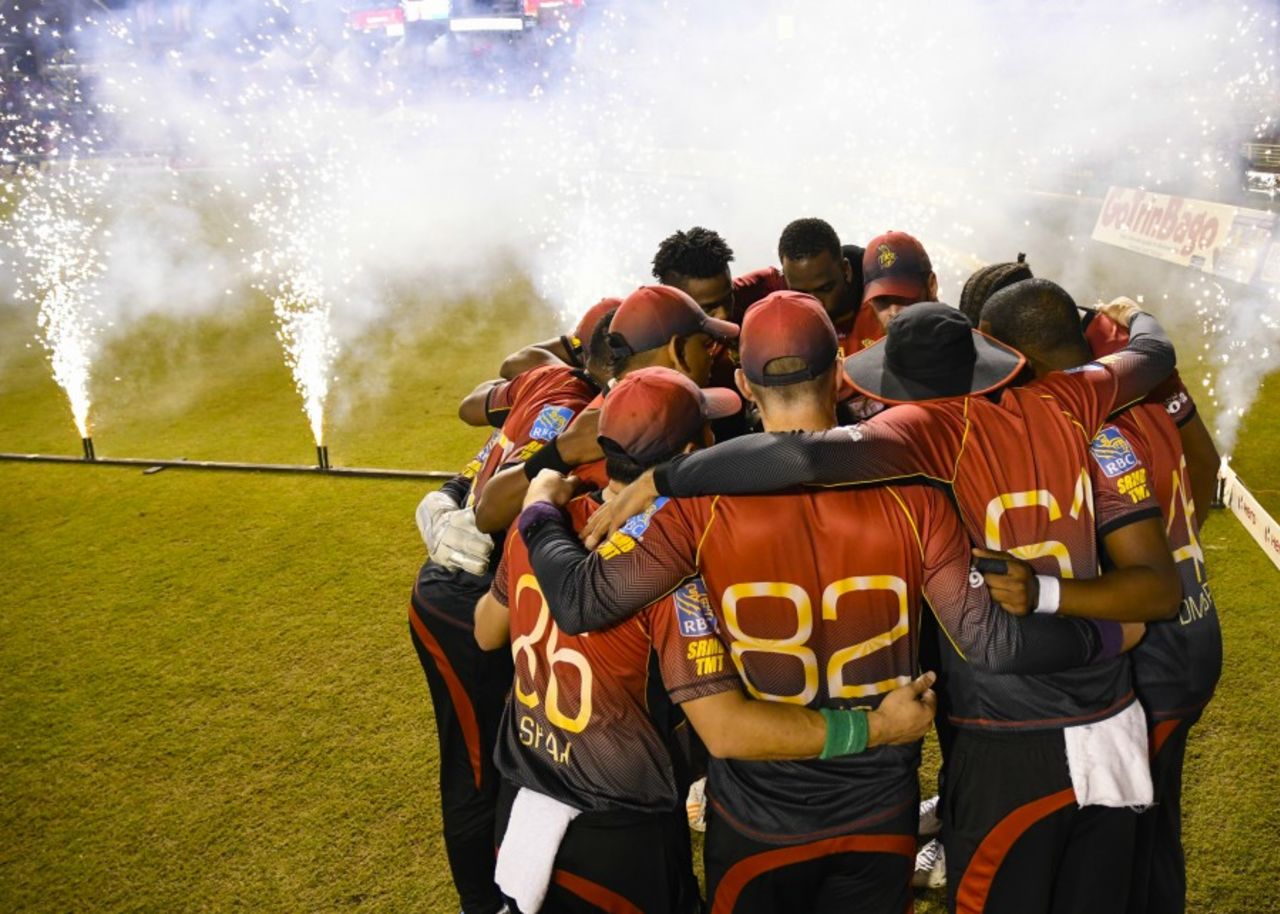 Trinbago Knight Riders huddle up by the boundary, and fireworks, Trinbago Knight Riders v St Kitts and Nevis Patriots, CPL 2017, final, Tarouba, September 9, 2017