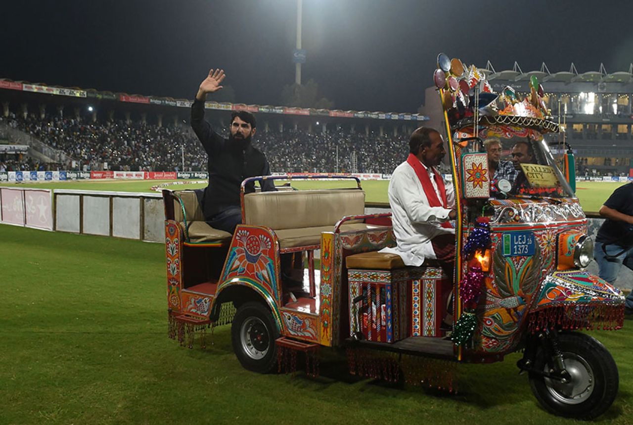 Former Pakistan captain Misbah-ul-Haq rides on an auto-rickshaw as he waves to the crowd, Pakistan v World XI, 3rd T20I, Lahore, September 15, 2017 