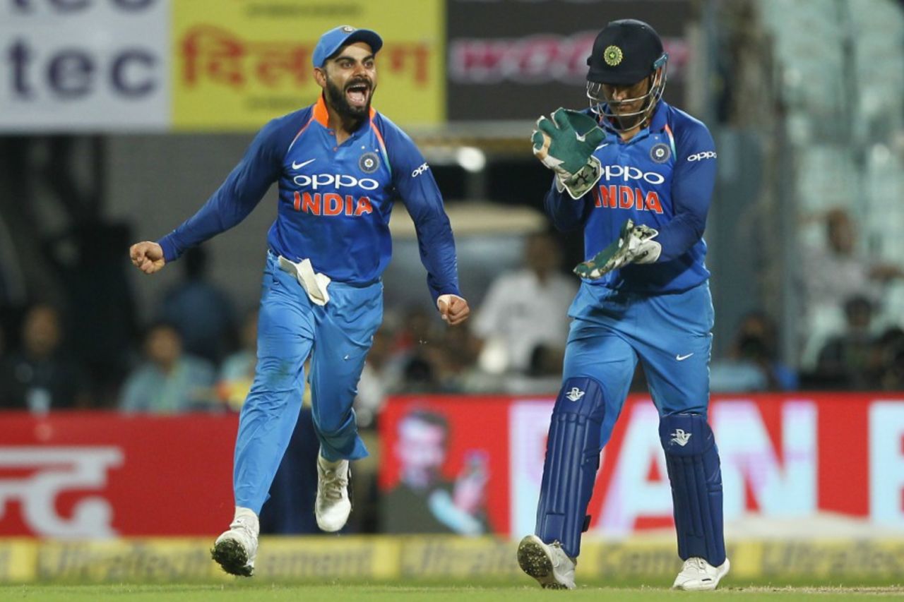 The contrasting celebrations of MS Dhoni and Virat Kohli after Travis Head's wicket, India v Australia, 2nd ODI, Kolkata, September 21, 2017