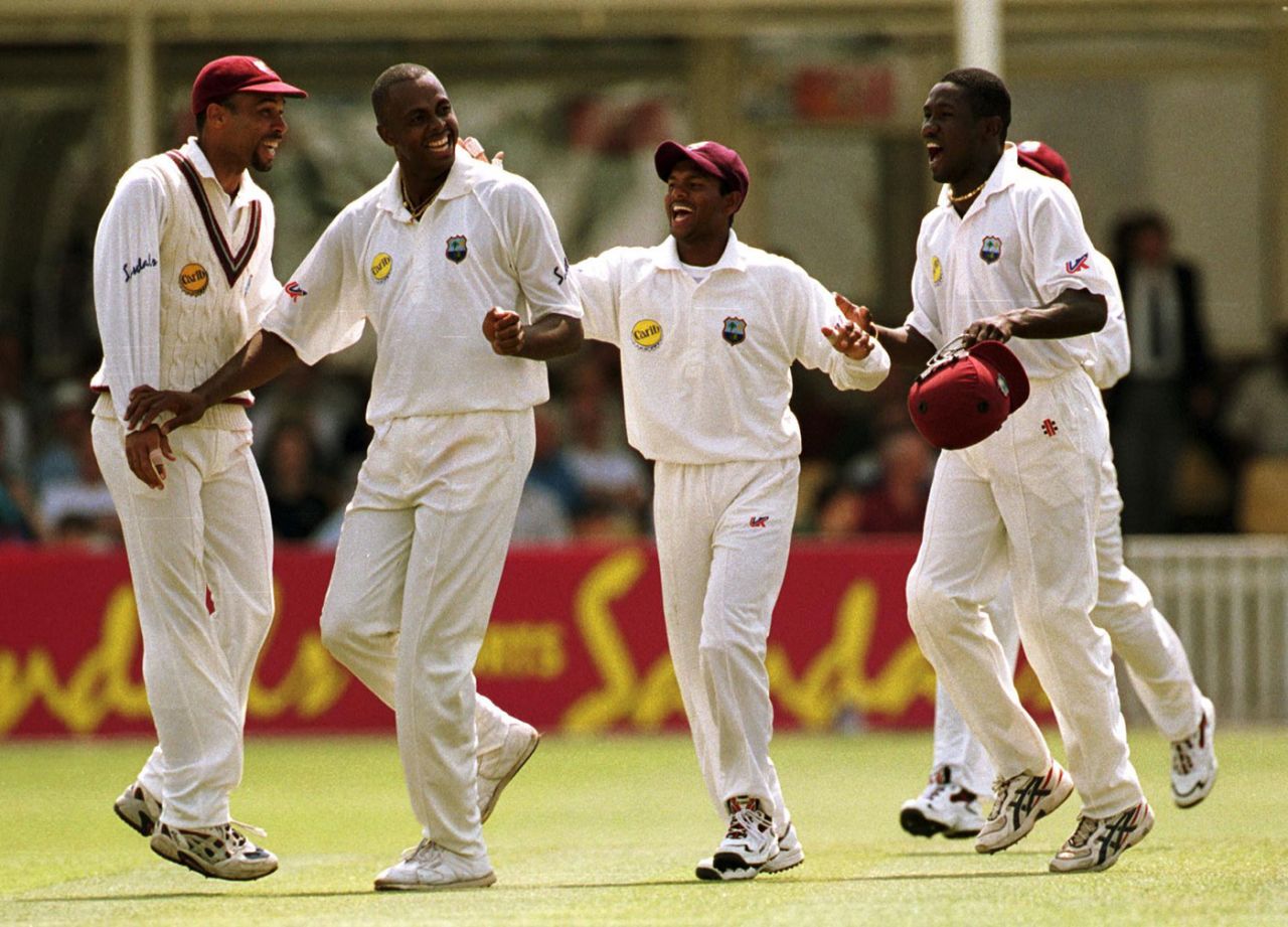 Jimmy Adams, Courtney Walsh, Shivnarine  Chanderpaul and Wavell Hinds celebrate a wicket, England v West Indies, first Test, day three, Edgbaston, June 17, 2000