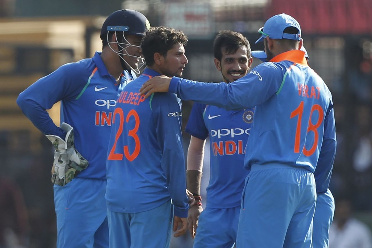 Kuldeep Yadav is mobbed by his team-mates, India v Australia, 3rd ODI, Indore