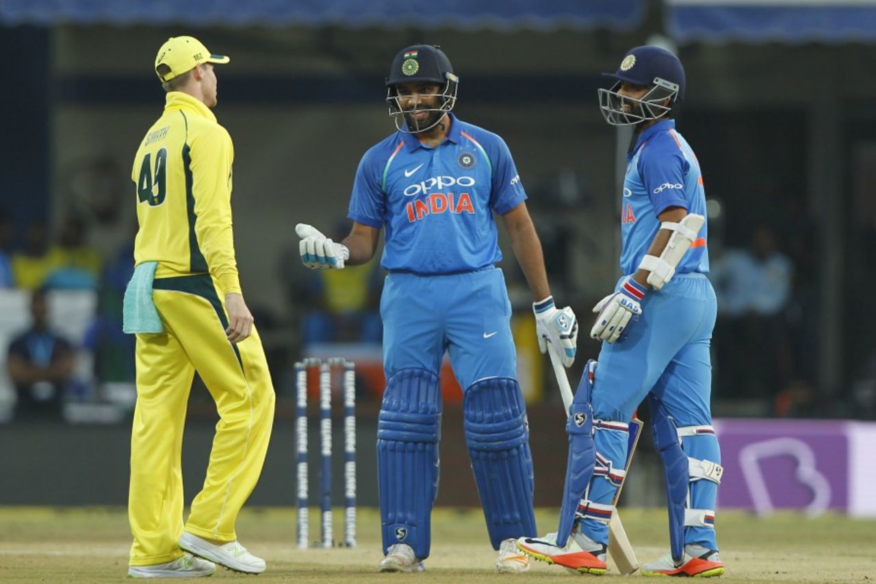 Rohit Sharma and Ajinkya Rahane chat with Steven Smith after a dead-ball call, India v Australia, 3rd ODI, Indore