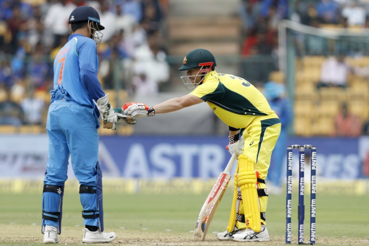 David Warner hands the ball back to MS Dhoni, India v Australia, 4th ODI, Bengaluru, September 28, 2017